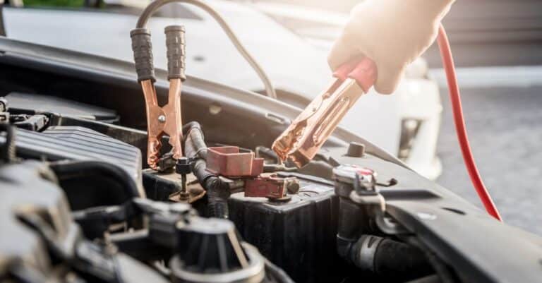 Mechanic jumping a car battery