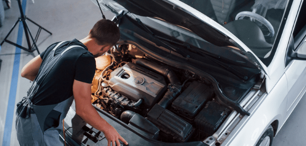 Mechanic looking at an engine