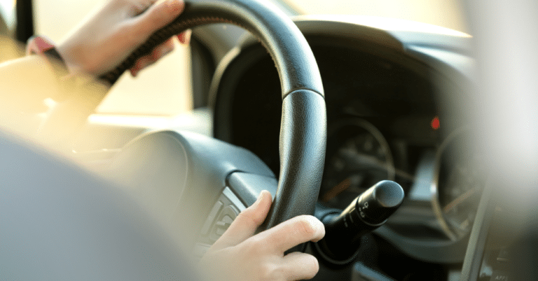 Closeup of hands on a steering wheel